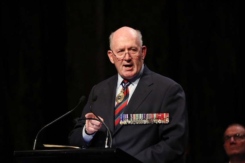 Governor General Sir Peter Cosgrove dons a military suit with medals