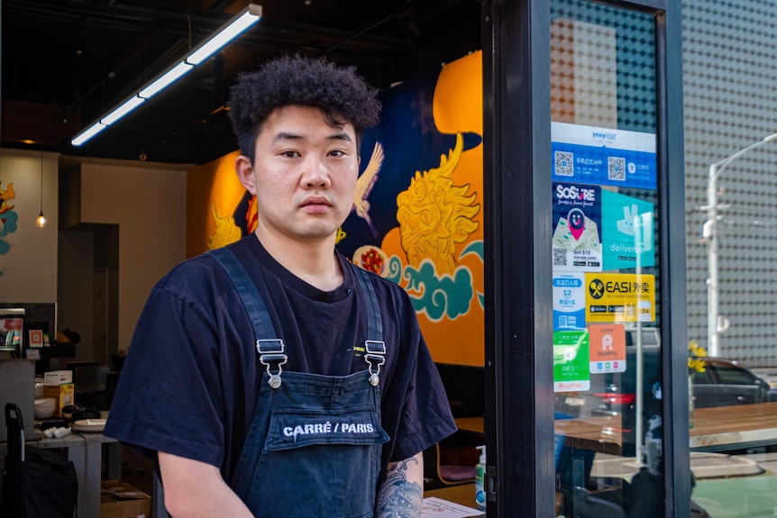 Boogie House Hotpot owner Shiwei Ding standing in the doorway