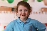 Prep grade school girl in classroom smiling