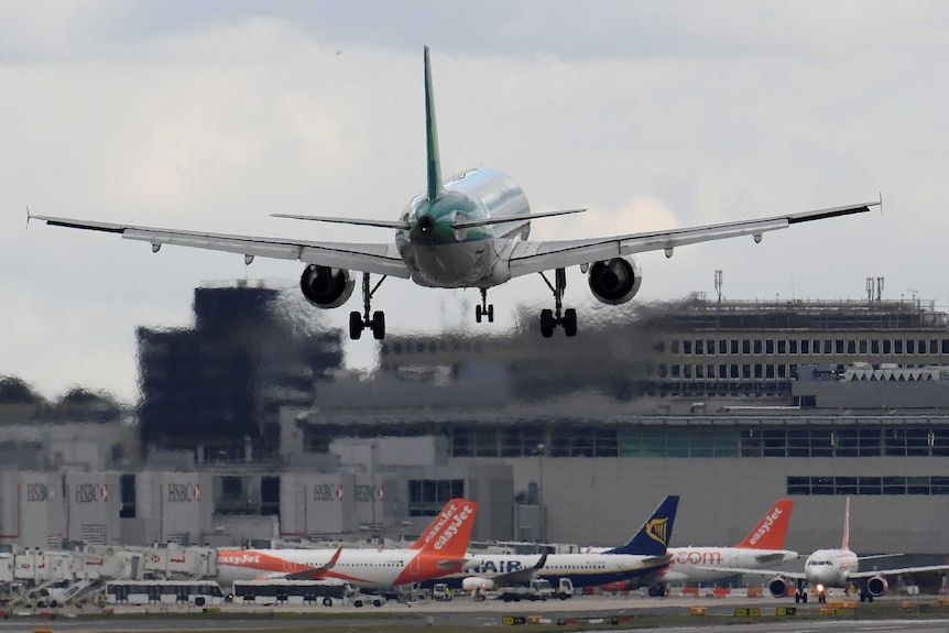 A passenger aircraft lands at Gatwick Airport in southern England, Britain.