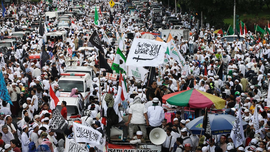 Muslim protesters march during a protest against Jakarta's Christian Governor Basuki "Ahok" Tjahaja Purnama.