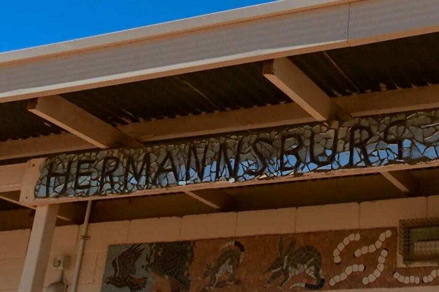 The front of an art studio covered in mosaic with the words Hermannsburg Potters