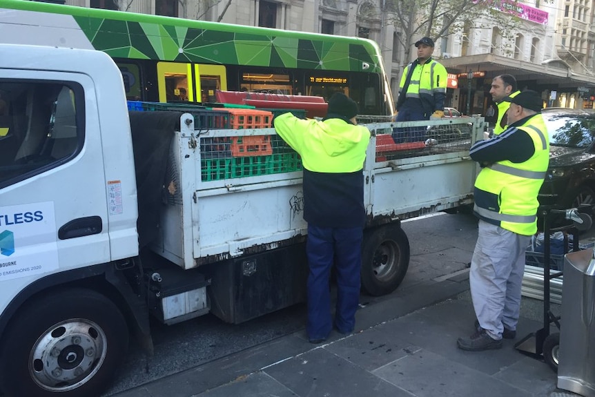 Council workers remove makeshift structures from protest camp