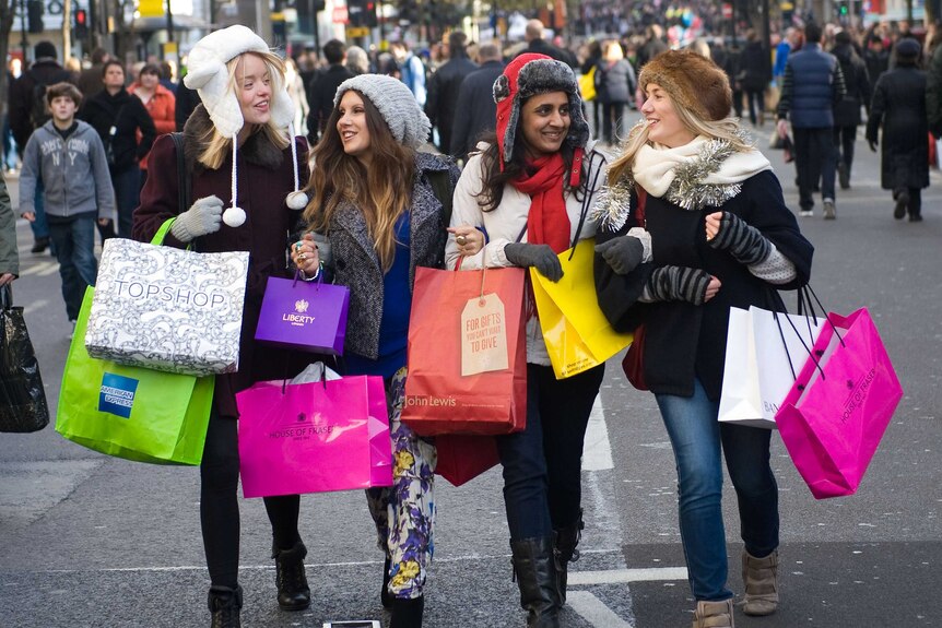 Shoppers walk down Oxford Street, London