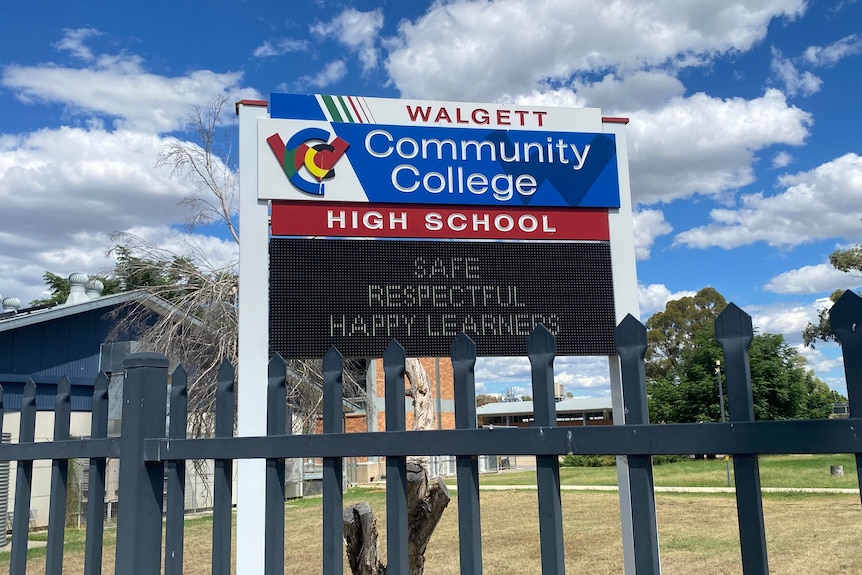 A sign outside Walgett Community College that says "Safe, respectful, happy learners".