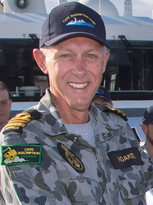 Lieutenant Commander Steven Noakes wears a Navy uniform reading "Cape Inscription".