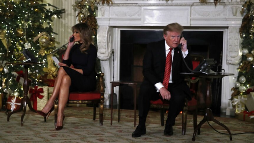 Donald Trump and Melania Trump talking on the phone during christmas