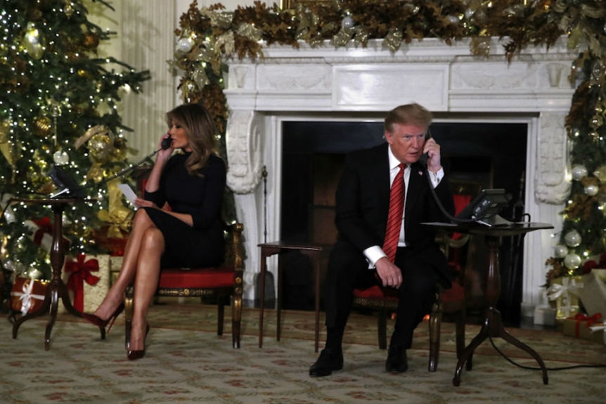 Donald Trump and Melania Trump talking on the phone during christmas