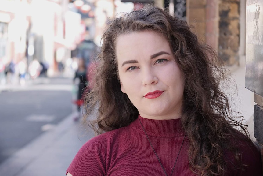 Sophie Worsnop-Hair poses for a portrait on Little Bourke Street in the Melbourne CBD