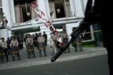 Indonesian Police stand in front of the Ritz Carlton hotel in Jakarta