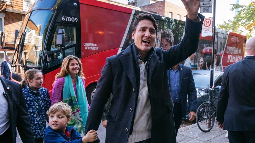 Canadian Prime Minister and Liberal leader Justin Trudeau arrives at a Montreal polling station with his son, daughter and wife.