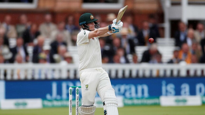 Steve Smith rolls his wrists over a short ball with a pull shot in front of the Lord's pavilion.