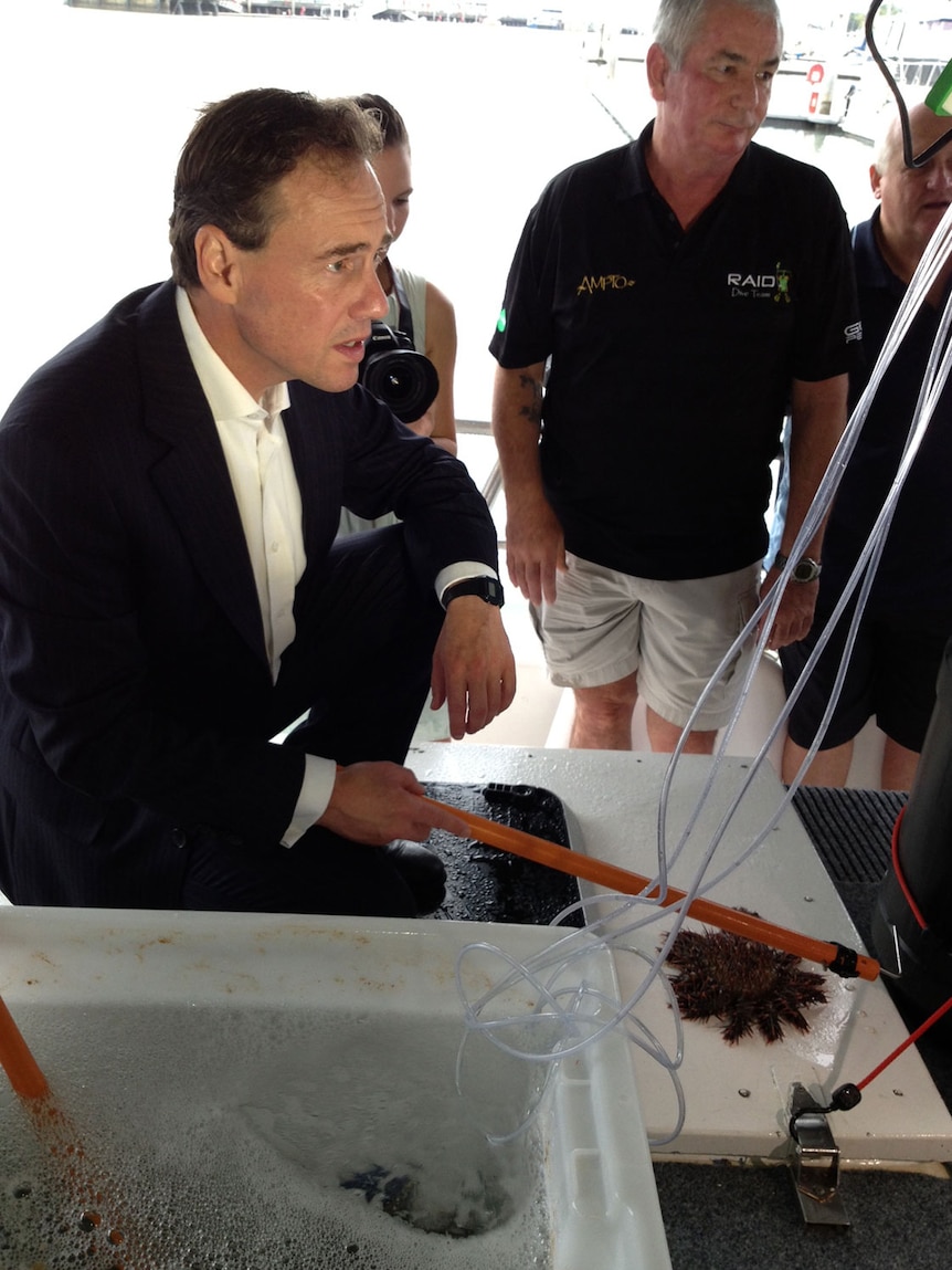 Federal Environment Minister Greg Hunt with James Cook University researchers