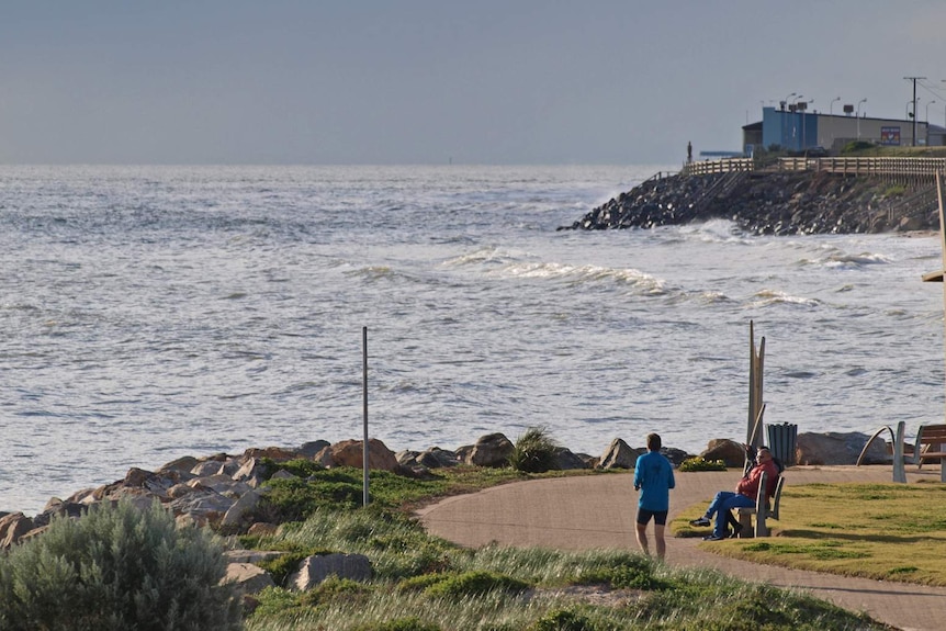 Watching the waves roll in at West Beach.