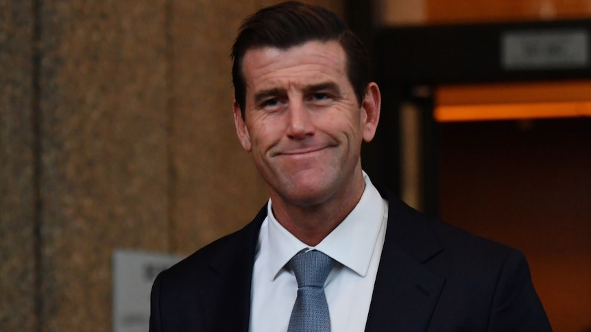 Ben Roberts-Smith smiles outside court