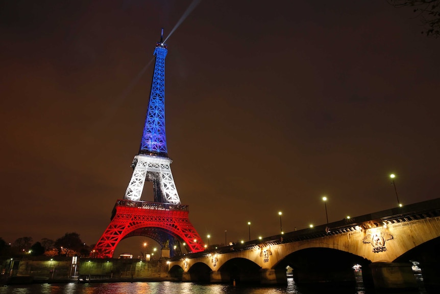 The Eiffel Tower is lit with the blue, white and red colours of the French flag after reopening.