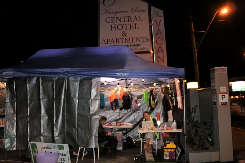 A tarp and tent set up with lights next to Kangaroo Point Central Hotel and Apartments