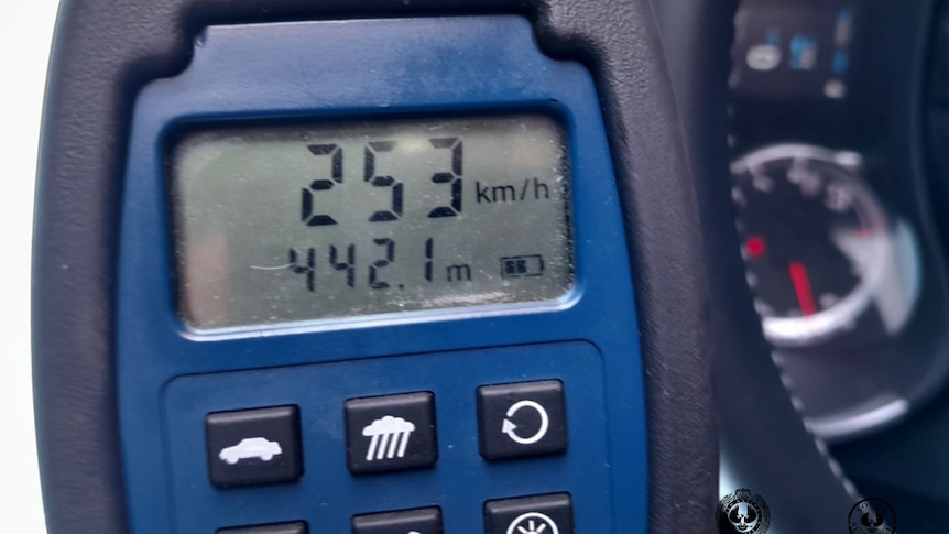 A speed gun showing 253 kilometres per hour.