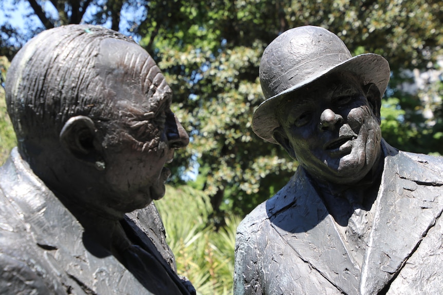 Henry Bolte and Albert Dunstan bronze statues stand next to each other.