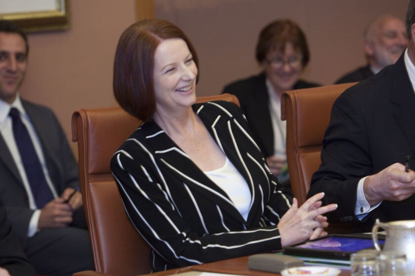 Prime Minister Julia Gillard laughs during in the COAG meeting in Parliament House, Canberra, on February 13, 2011 (AAP)