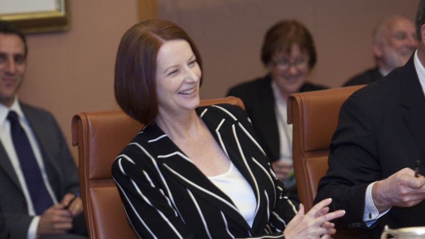 Prime Minister Julia Gillard laughs during in the COAG meeting in Parliament House, Canberra, on February 13, 2011 (AAP)