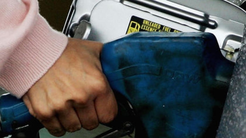 A motorist fills up her car with petrol in Sydney.