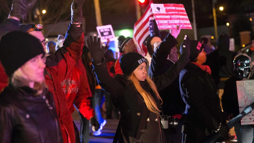Protests block street in protest after Missouri police shoot black man