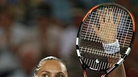 Nadia Petrova holds up her racquet to salute the crowd at Burswood dome.