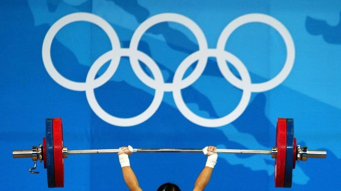 Chen Xiexia defended her title to claim one of China's eight weightlifting gold medals.