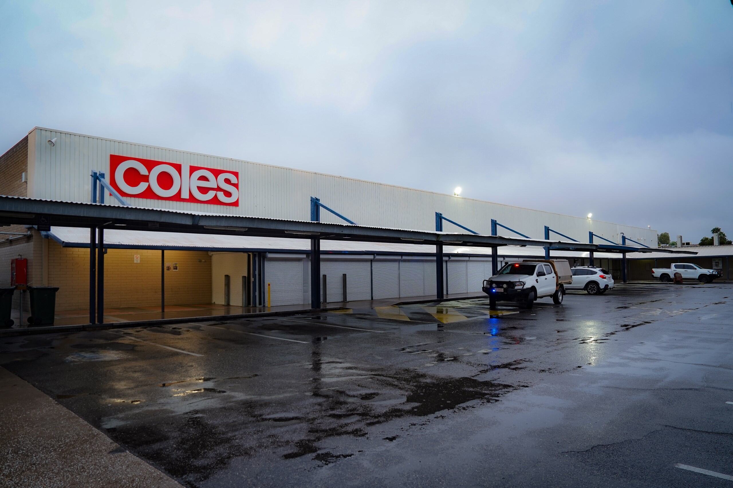 Coles supermarket and carpark during wet day 