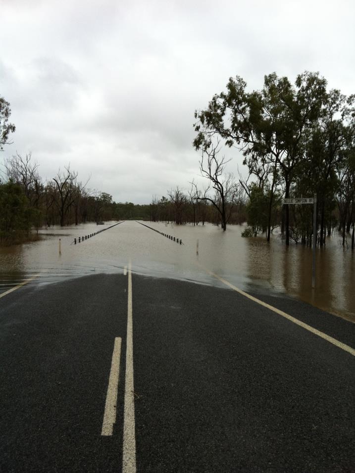Flooded road at intersection of Nellie Simpson Road and Gladstone Monto Road in central Qld in March 2013
