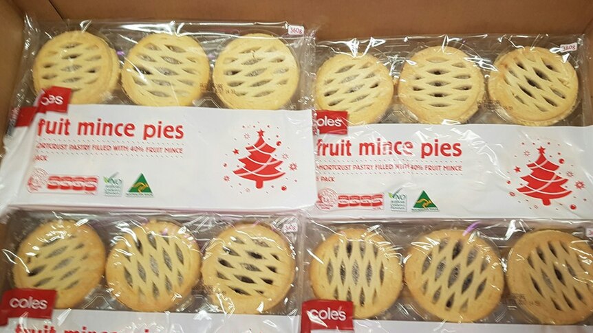 A supermarket display of packaged fruit mince pies.