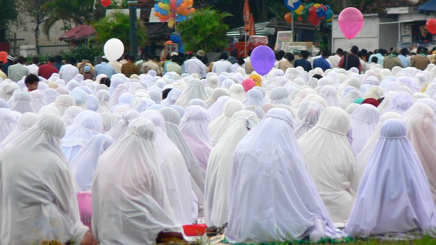 Female Muslims are gathering during a prayer congregation