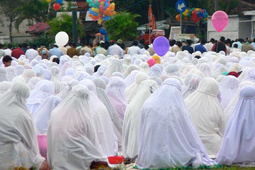 Female Muslims are gathering during a prayer congregation