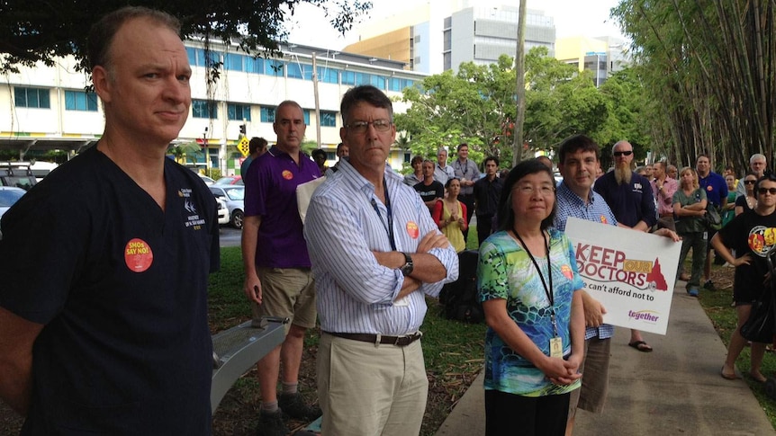 Foreground LtoR: Doctors Sean McManus, Peter Boyd and Roxanne Woo spoke at a rally outside the Cairns Hospital.