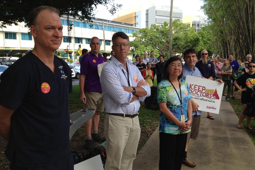 Foreground LtoR: Doctors Sean McManus, Peter Boyd and Roxanne Woo spoke at a rally outside the Cairns Hospital.
