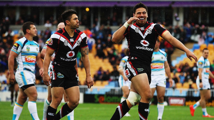 Henry and Johnson celebrate a try