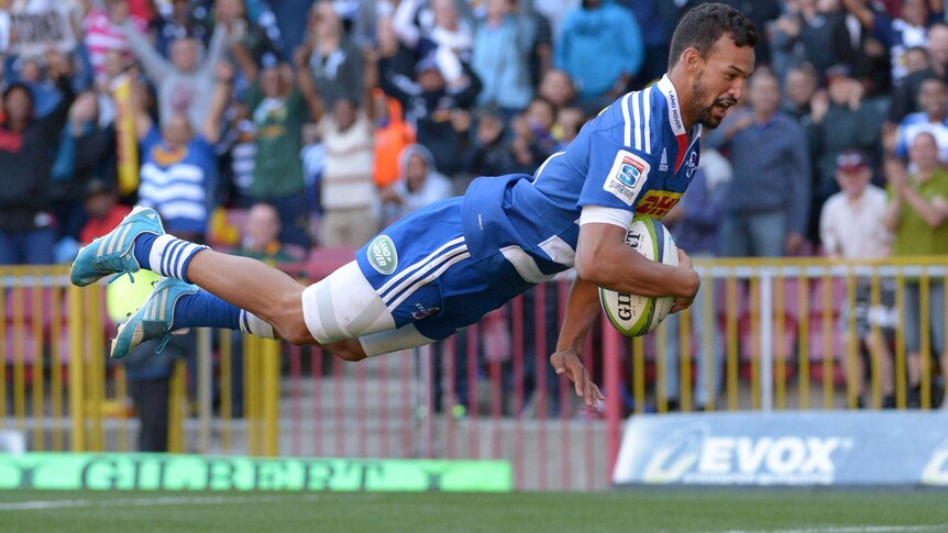 The Stormers' Dillyn Leyds dives over for a try against the Blues at Newlands on February 21, 2015.