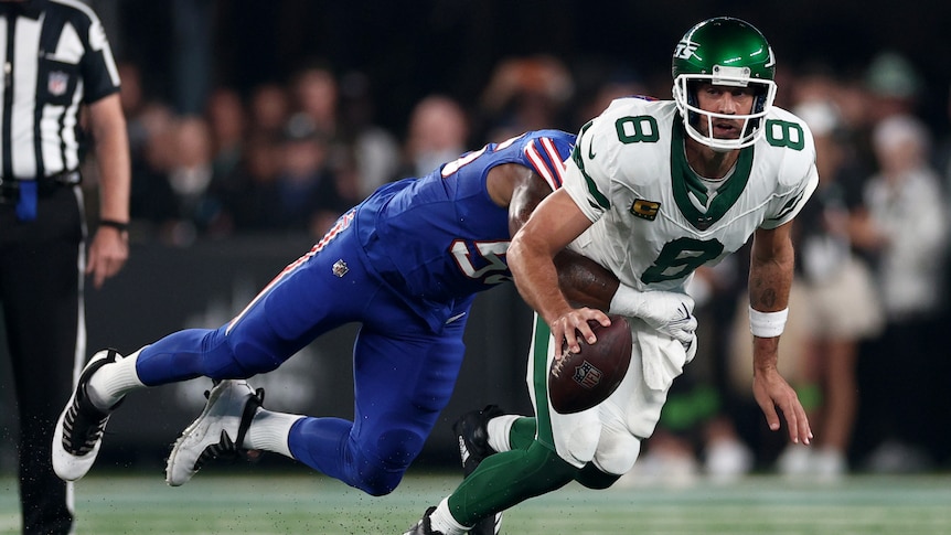 New York jets quarterback Aaron Rodgers is tackled by Buffalo Bills defensive end Leonard Floyd in their NFL season opener.