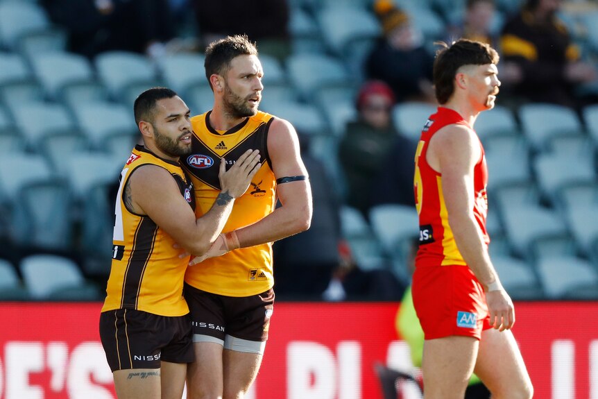 Jarman Impey pats Jack Gunston on the chest in congratulations