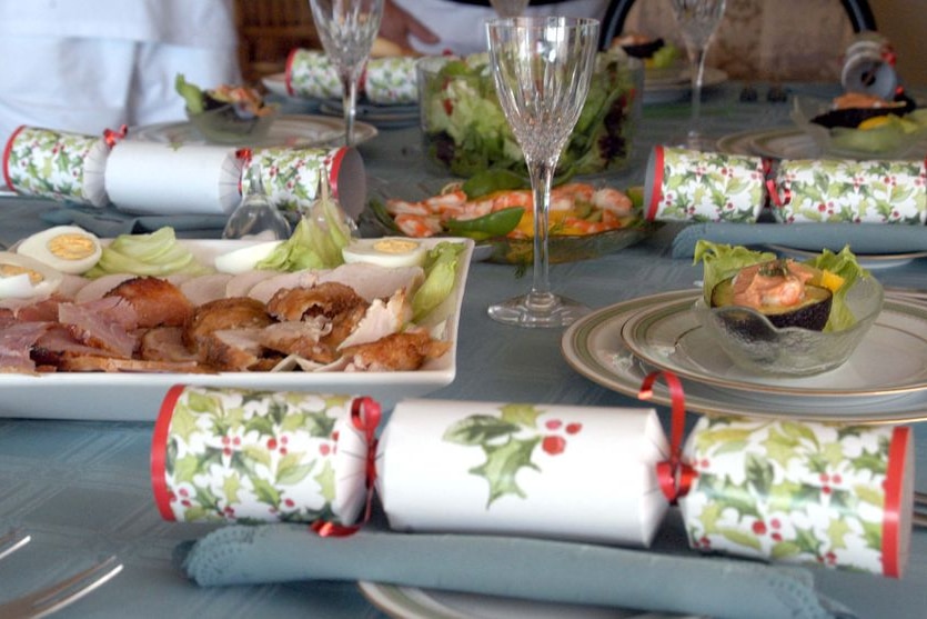 An 'Australian' Christmas lunch of cold meat, prawns and salad sits on a table