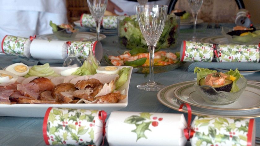 An 'Australian' Christmas lunch of cold meat, prawns and salad sits on a table