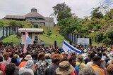 Protestors gather outside the parliament building in Honiara, Solomon Islands.
