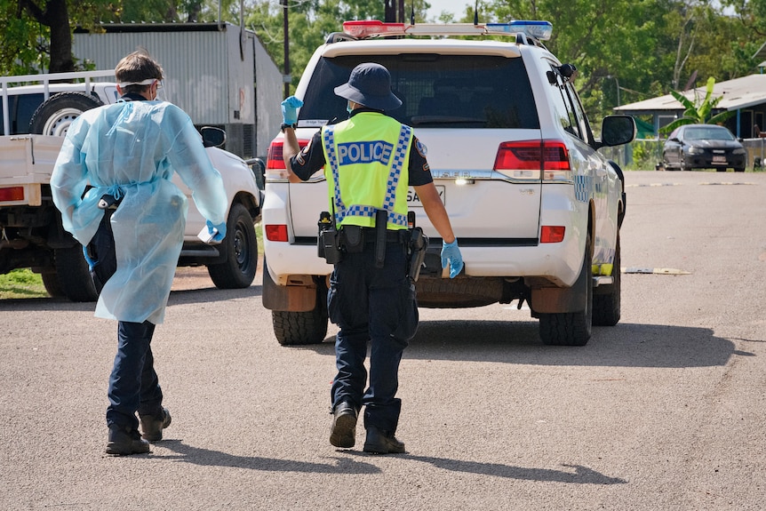 NT Police work their way through the locked down community of Rockhole.