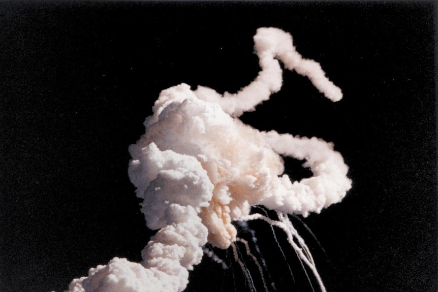 Space Shuttle Challenger explodes.