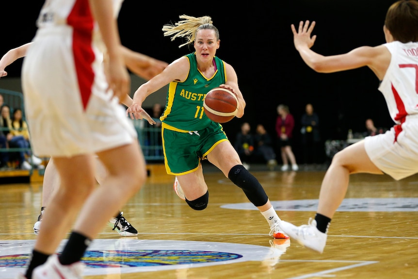 Australian basketballer Tess Madgen dribbles the ball down the court