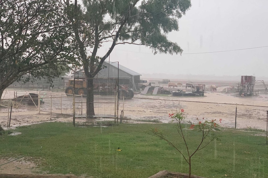 Rain falls at Wando Station as floodwaters build.