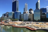 A view of the Elizabeth Quay construction site, with the Perth skyline in the background.