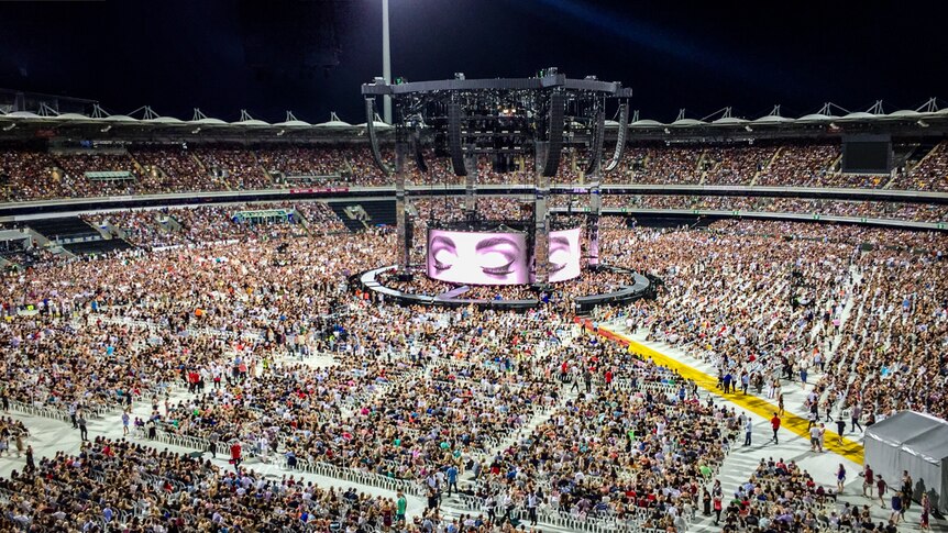 Fans clock to the Adele concert at The Gabba in Brisbane.