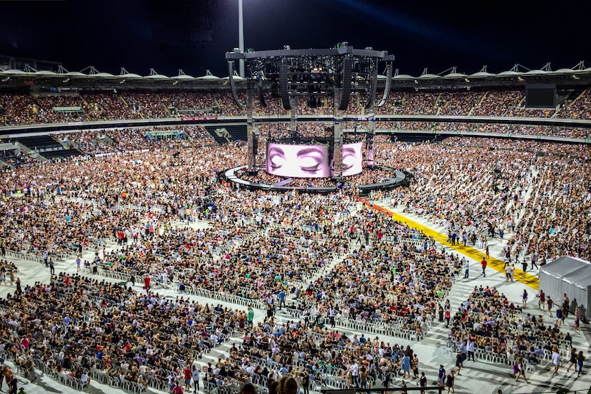 Fans clock to the Adele concert at The Gabba in Brisbane.